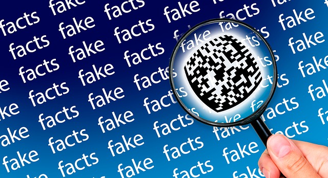 someone holding a magnifying glass with the word "fake" sometimes appearing in a sea of the word "facts"