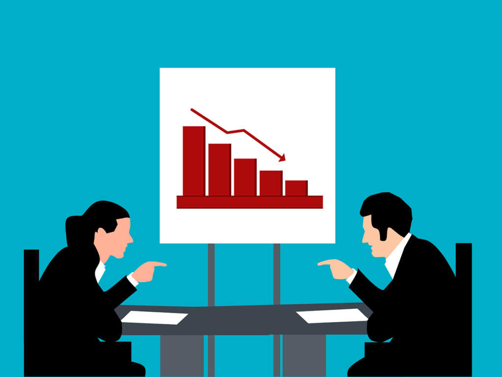 illustration of two people arguing across a table with a graph in the background. The graph is displaying decline