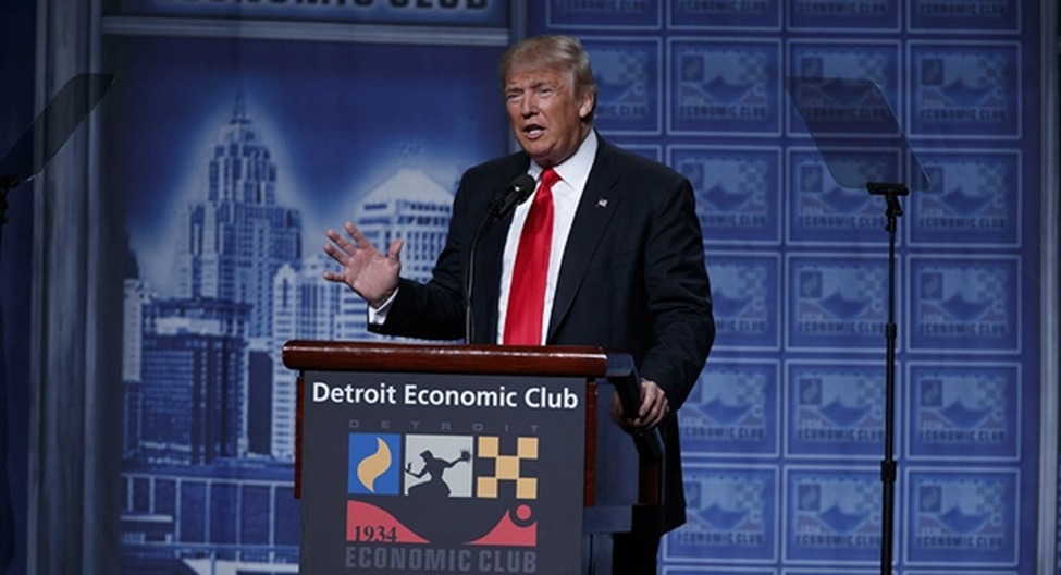Photo of President Trump behind a podium addressing the Detroit Economic Club
